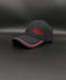 A black baseball cap with red embroidered text reading '1994 5 PLATINUM NUM LOVES' on the front, featuring a red accent line along the edge of the curved brim, set against a dark gray background.