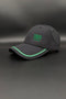 A dark gray baseball cap with green embroidered text reading '1906 gloria' on the front, displayed on a dark gray background.