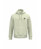 A light sage green pullover hoodie with a small black circular graphic on the left chest, displayed on a solid white background.