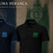 Two polo shirts displayed against a textured dark background: a black shirt in front with green trim and '1906 GLORIA' text on the chest, and a navy shirt behind it with blue trim and '1909 AVENGER 1996' text. Sporting Portugal branding is visible.