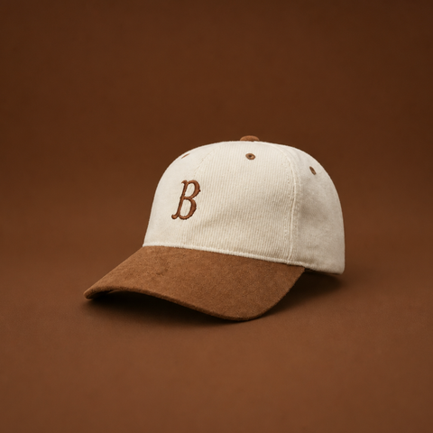 Some things don’t need to shout.

The Heritage Cap brings together two timeless textures: corduroy and suede.

A premium cap with a vintage feel, finished with a single embroidered B — simple, understated and made with attention to every detail.

Made to be worn.
Made to last.
Made to get better with time.

CORDUROY. SUEDE. BAIRRO.

Available in Black / Camel and Cream / Camel.

FIRST DROP — LIMITED EDITION.
20 Black. 20 Cream. That’s it.

DETAILS
Premium corduroy
Suede-effect brim
Embroidered B
Camel/brown