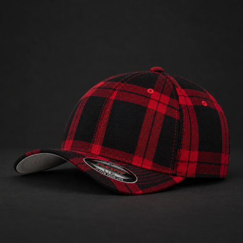 A structured baseball cap featuring a red and black plaid pattern, photographed on a dark studio background. The cap has a curved brim with a light gray underside and a visible New Era 9FIFTY sticker on the front.
