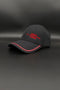 A black baseball cap with red embroidered text reading '1994 5 PLATINUM NUM LOVES' on the front, featuring a red accent line along the edge of the curved brim, set against a dark gray background.