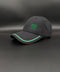 A dark gray baseball cap with green embroidered text reading '1906 gloria' on the front, displayed on a dark gray background.